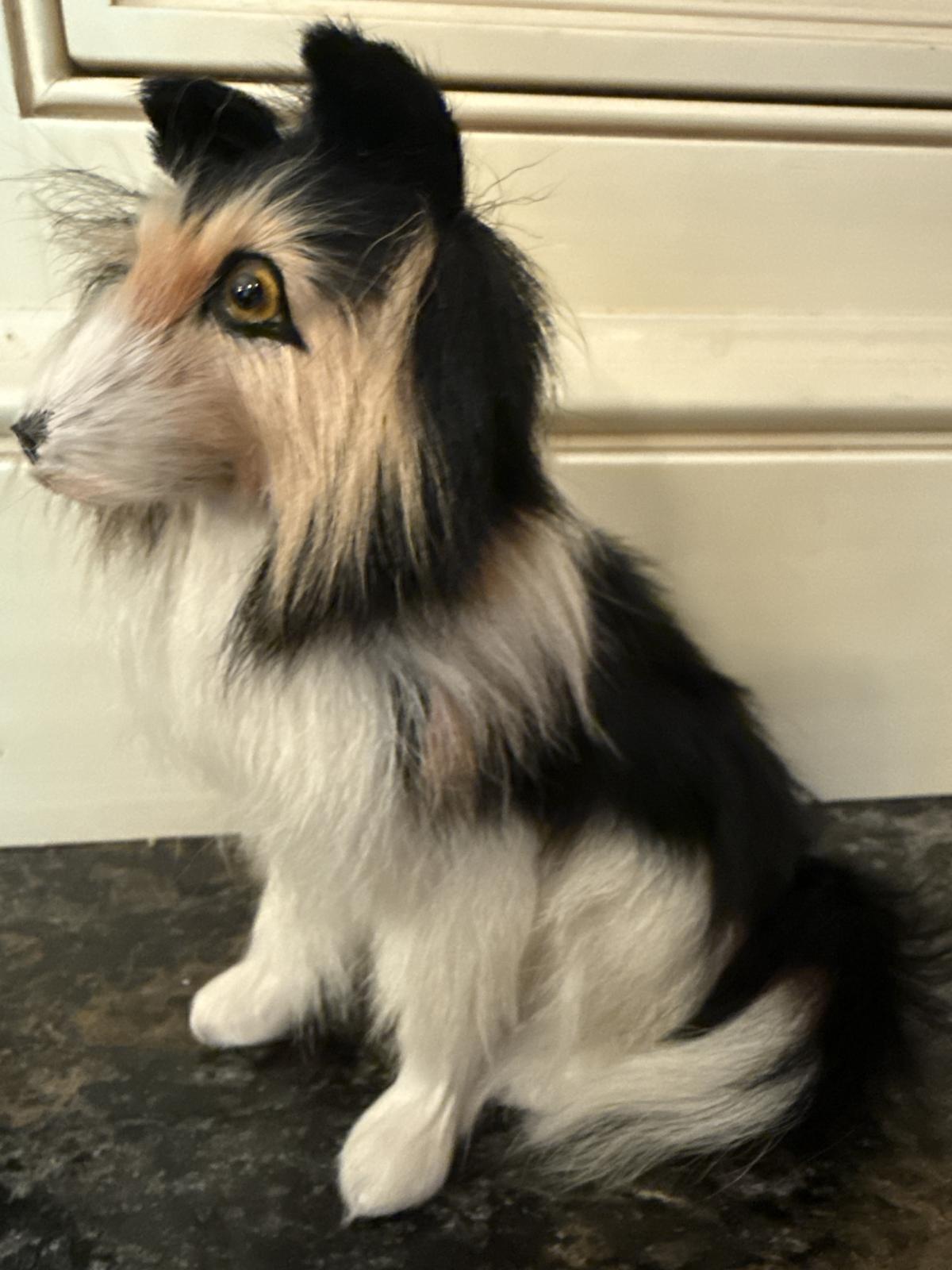 Side view of tricolor collie figurine made from goat fur.