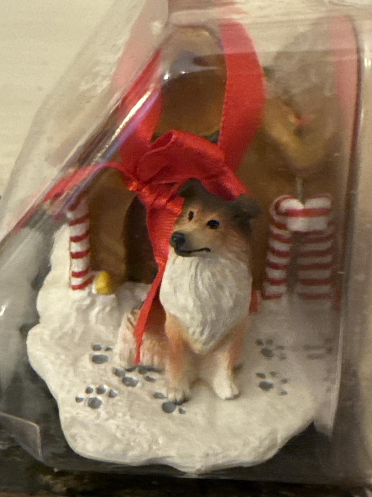 Gingerbread house ornament in packaging.
