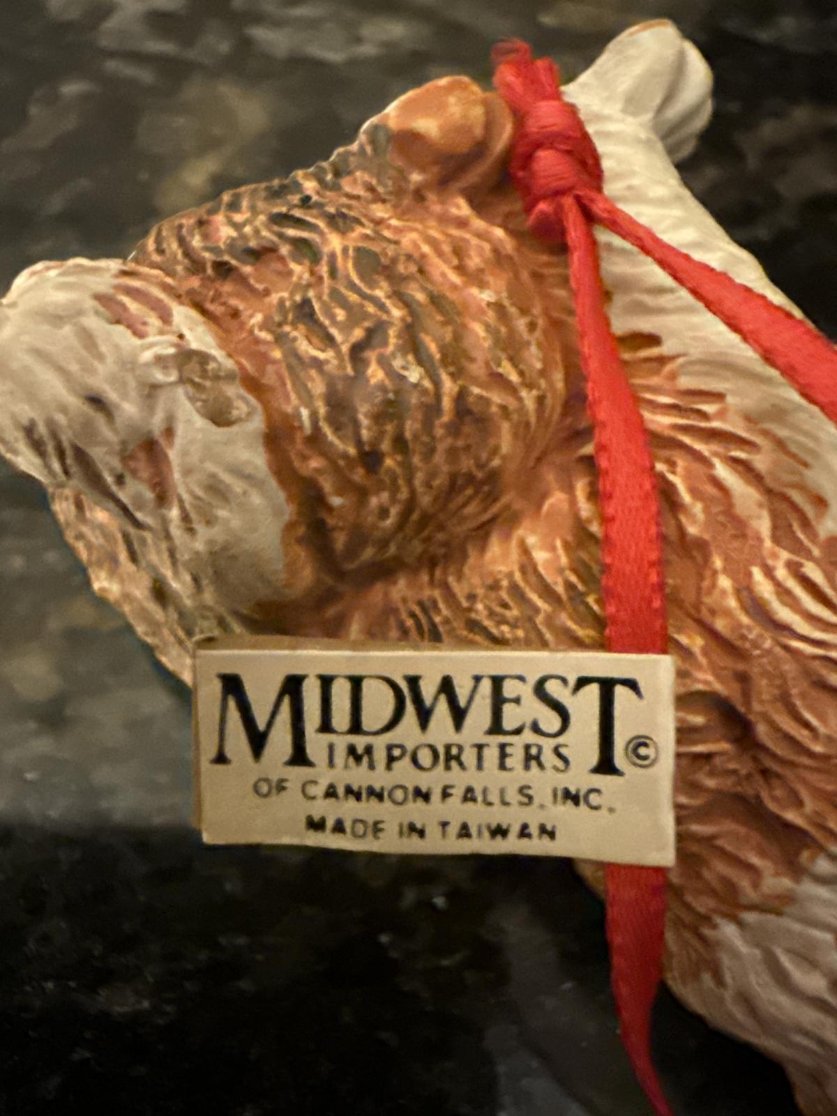 Label on collie ornament showing maker's mark.