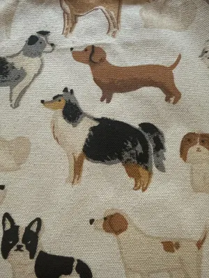 Close-up of dog illustrations on a canvas tote bag.